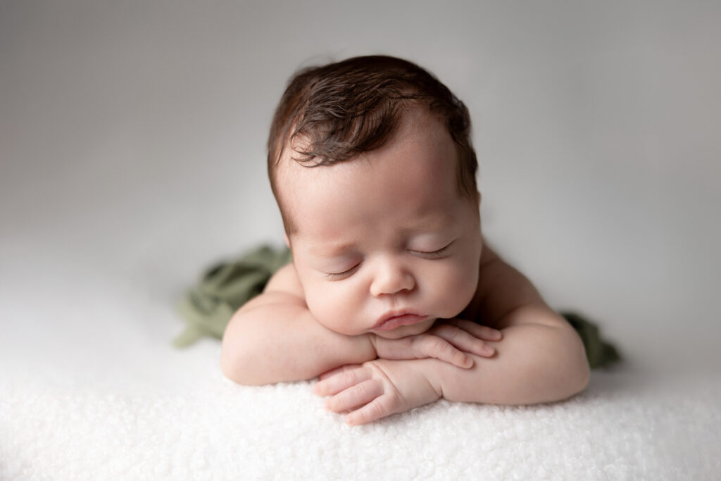 baby sleeping peacefully in the chin on hands pose, medina county ohio