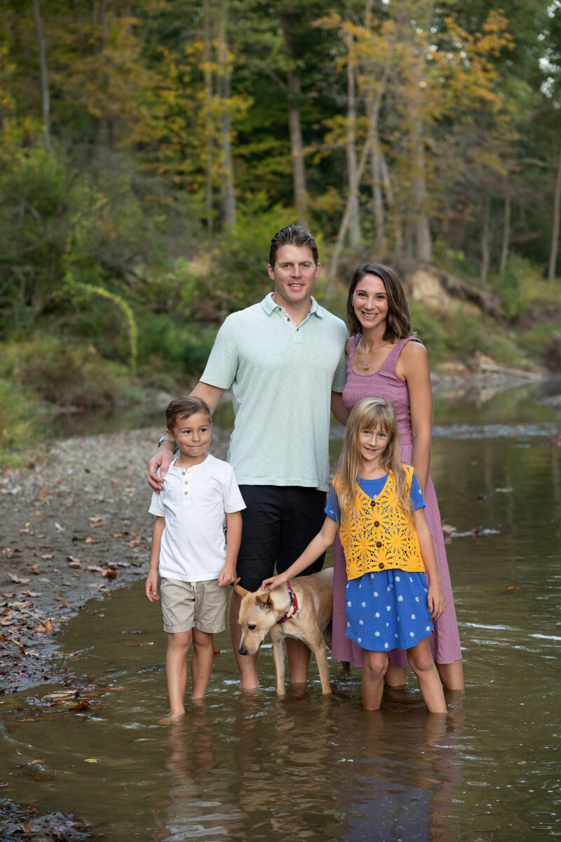 summer family portrait in a river