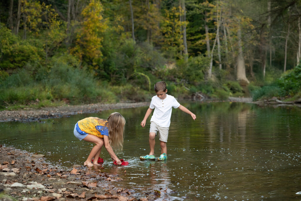 children playing in a river in valley city ohio