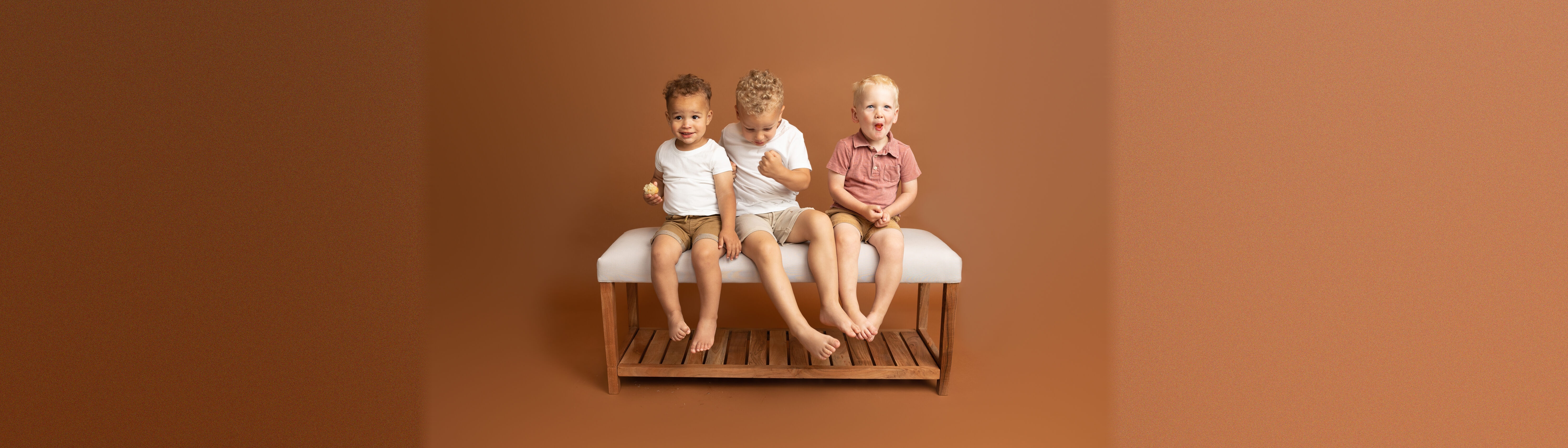Boys goofing around on a bench