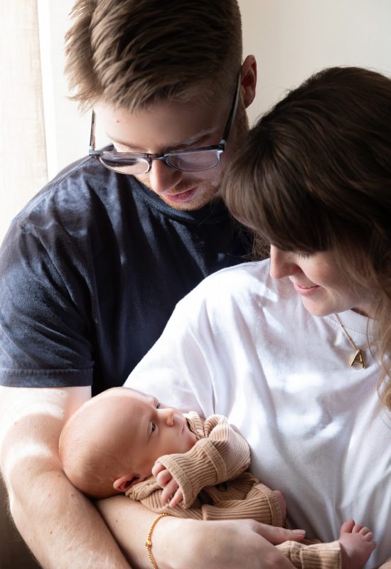 Parents gazing at their new baby